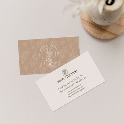 Business card design for wedding photographer on neutral background