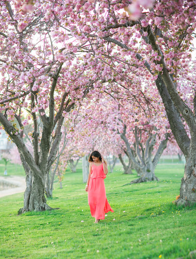 Girl surrounded by Cherry Blossom Trees