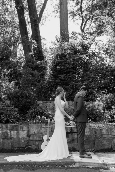 bride and groom kissing after sharing a piece of cake