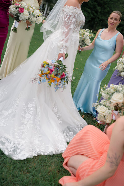 Bride and her bridesmaids candidly interacting with each other at Cape May, New Jersey wedding.