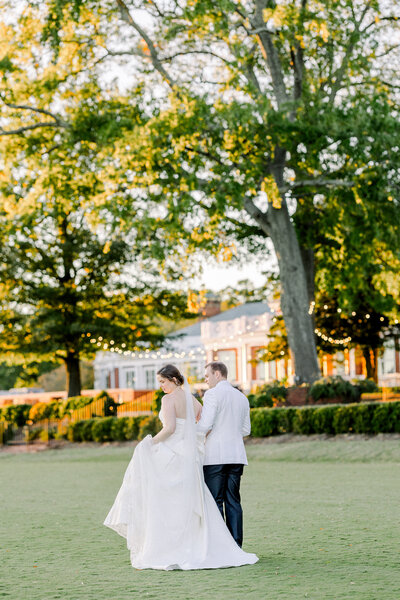 Luxury Wedding Photographer Atlanta | Bride And Groom Walking AtCountry Club of Virginia Westhampton Wedding Venue