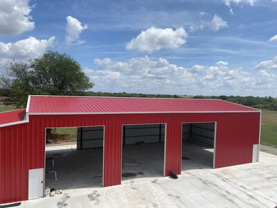 Custom red metal structure by Precision Steel Inc.