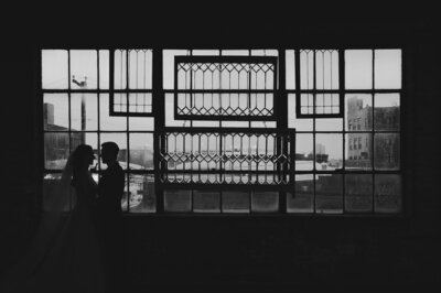 Couple in front of window at Salvage One