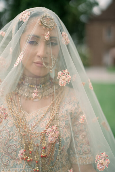close up of indian bride in full wedding garbe