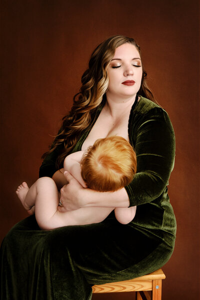 Red headed baby breast feeding in St Louis MO studio for a motherhood photo session