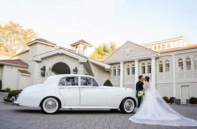 wedding car with bride and groom