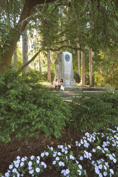 family of three newborn photos in park