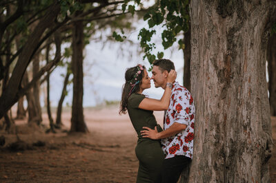 couple in the trees at kanaha beach park maui hawaii
