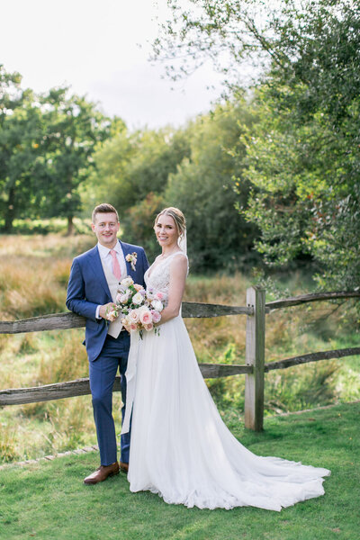 pink purple and white flower arrangements on blush linen at a Fulham Palace wedding