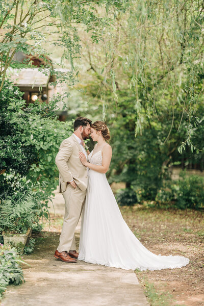 Bride and groom portraits under weeping willow at 9 Oak Farms. Photo taken by Chicago + Atlanta Photographer Ella Grace Richards of Forever Love Photography 