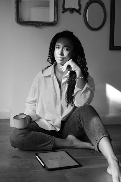Woman holding cup of tea smiling