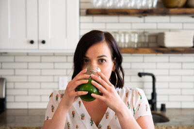 Erika Belanger drinking a green juice