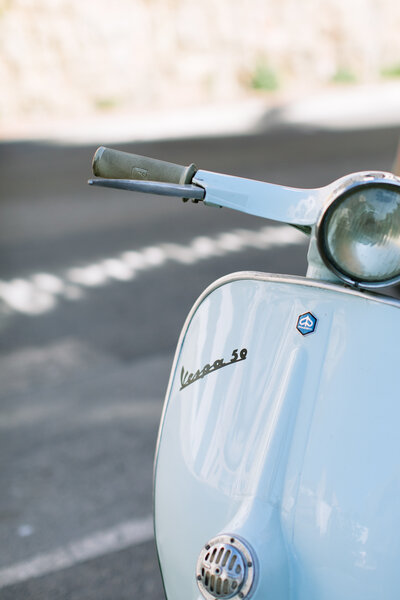 An upclose image of a Vintage White Vespa