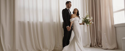 Bride and groom holding hands