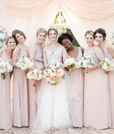 Bridesmaids dressed in blush at the Terrace Club in Dripping Springs