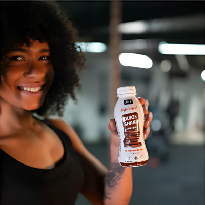 Woman holding a protein shake – Muse specializes in branding, social media marketing, and campaign ads for wellness and fitness brands in Sydney.