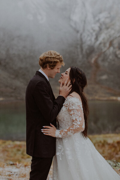 Bride and groom walk together in the San Juan Mountains