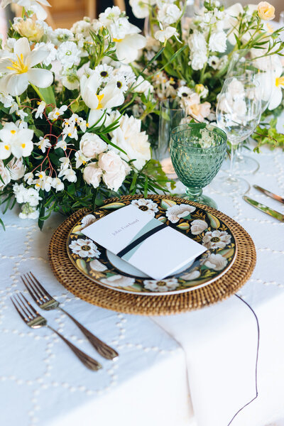 Flower plate next to floral centerpieces