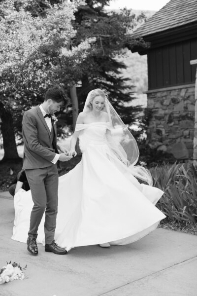 Bride and groom walking holding hands