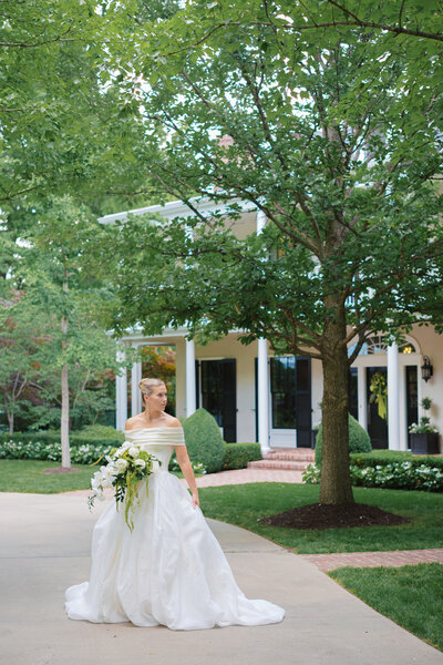 bride and groom twirling on blue checker dance floor at Mission Hills Country Club Kansas City wedding