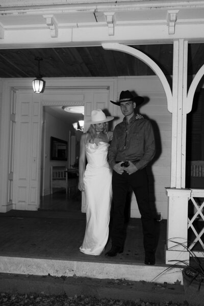bride and groom in cowboy hats