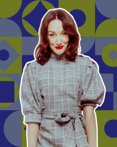 Bestsellers Ulrike Image  2  Woman Smiling grey dress blue pattern background
