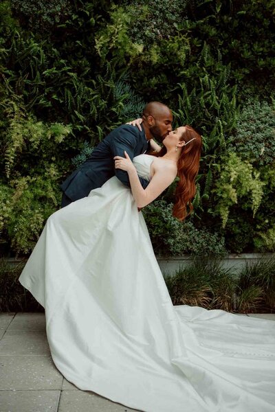 a bride and groom embrace during their wedding ceremony at Hart and Main