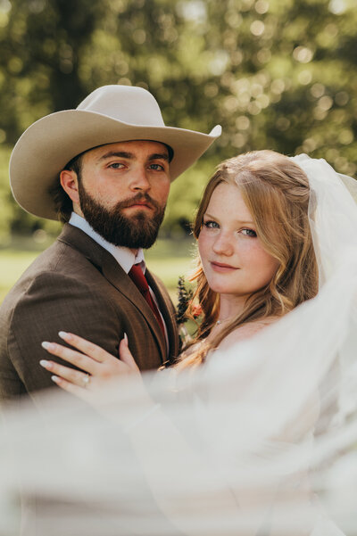 bride groom at best east texas wedding venue mt vernon texas outdoor ceremony dallas wedding lacey nicole photographer