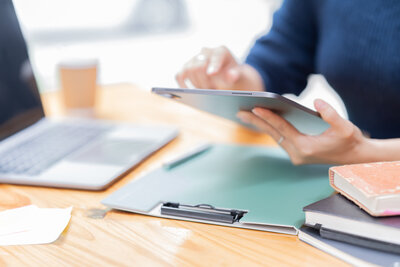 A bookkeeper working on a  tablet