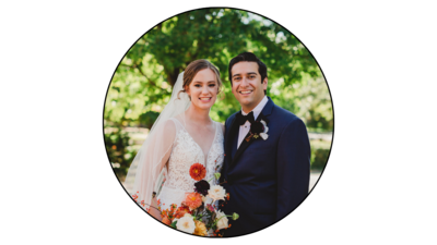 A nashville bride and groom standing together with flowers