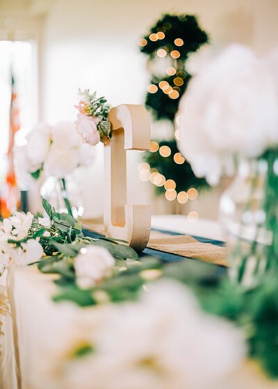 sweetheart table decorated at wedding reception