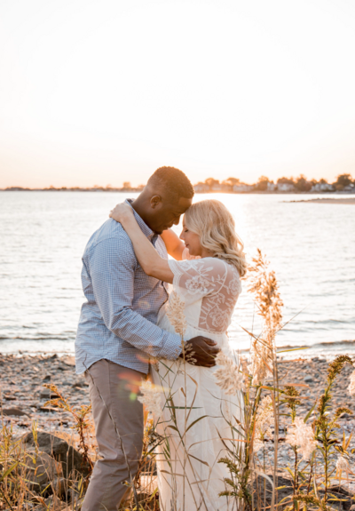 couple maternity session at the westport beach shoreline ct