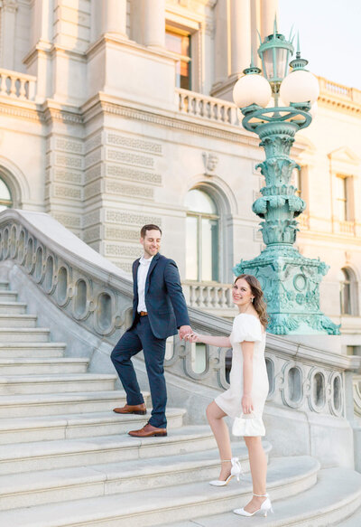 Bride and Groom on the stairs at the Library of Congress in Washington, DC. Captured by Washington DC Wedding Photographer Bethany Aubre Photography.