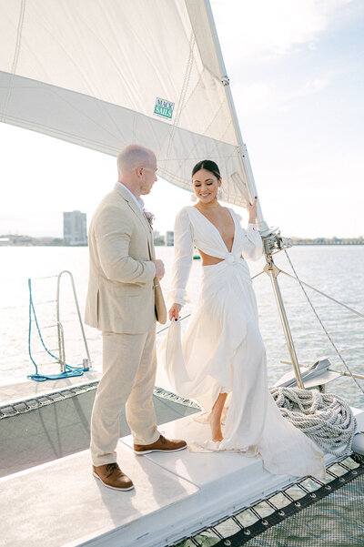 Bride and Groom on a sailboat on their wedding day.