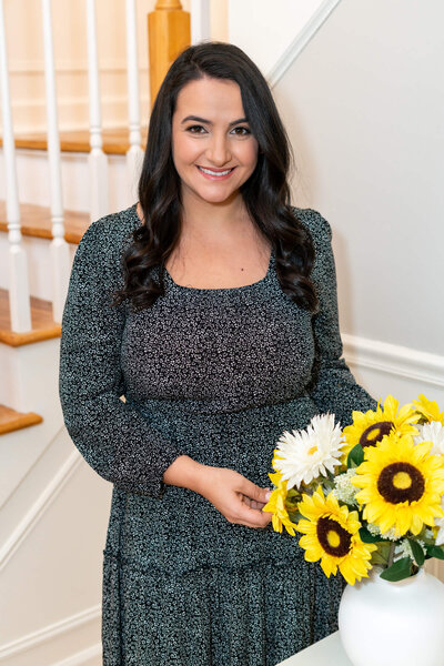 Aubrey of Graciously Gifted Next To Sunflower Bouquet