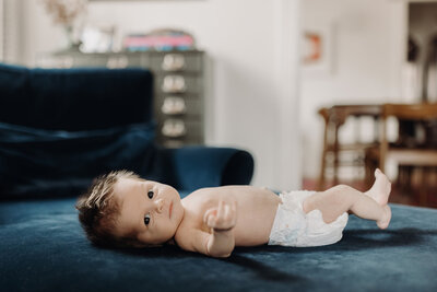 stockton newborn session baby laying on a blue couch