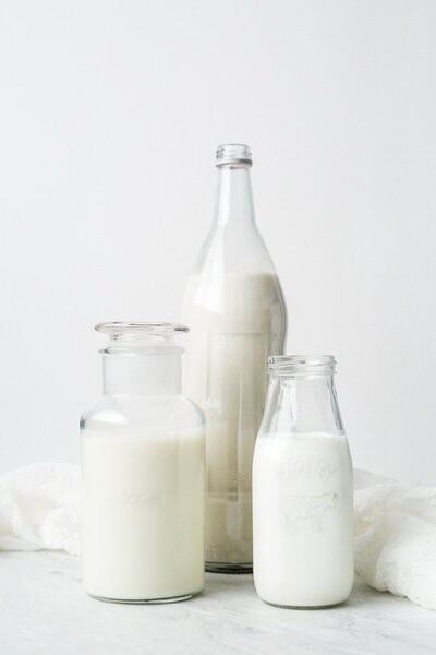 milk in glass jugs
