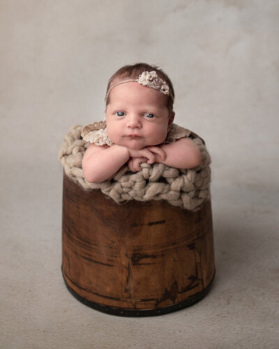 Cute Newborn Baby in a Bucket