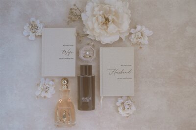 Film layflat photo of vow books and wedding details with flowers