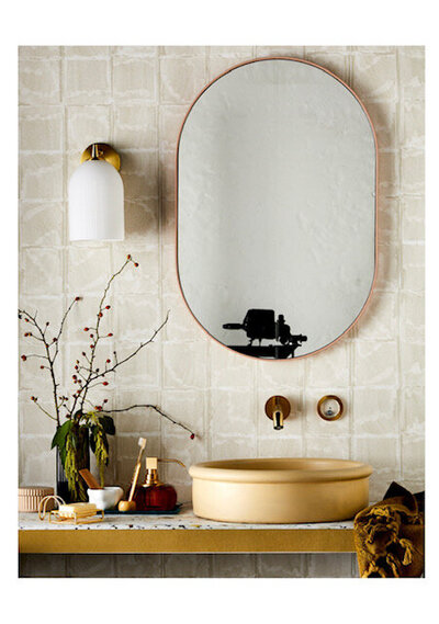 Modern Golden bathroom setting for Lisa Hunter Design in a magazine spread in Melbourne