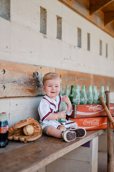 little boy session in baseball dugout