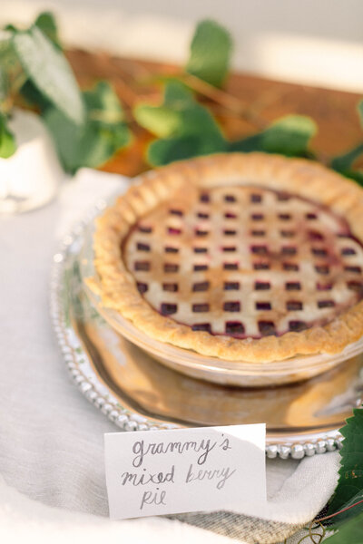 A homemade pie baked by the bride’s granny, served as a heartfelt dessert at Peyton Curry’s intimate backyard wedding in Richmond, Virginia. A sentimental touch captured in documentary-style wedding photography by a film wedding photographer.