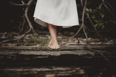 Caroline Weiss by the water’s edge, reflecting on healing and inner transformation.