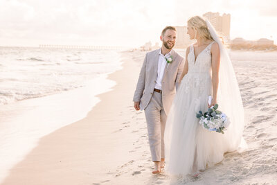 Bride leads groom down beach after private ceremony. Photo taken by Chicago + Atlanta Photographer Ella Grace Richards of Forever Love Photography 
