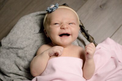 Newborn photography near Sherman TX; laughing baby