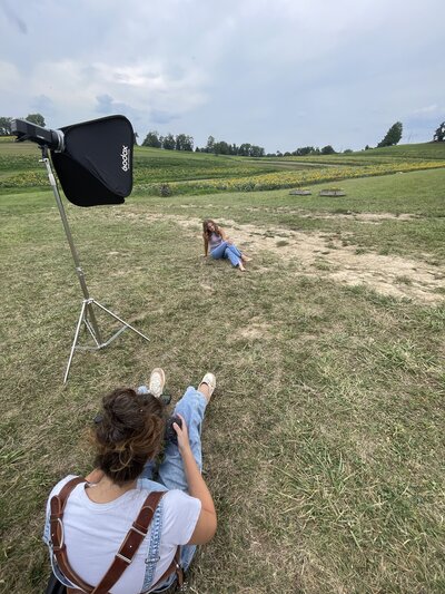 Heidi Iliff uses flash during a senior portrait session in a field near Pittsburgh PA