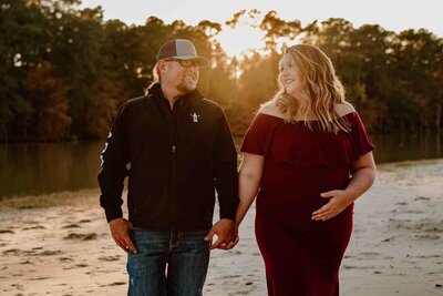 Shelby and Brian hold hands for maternity photoshoot