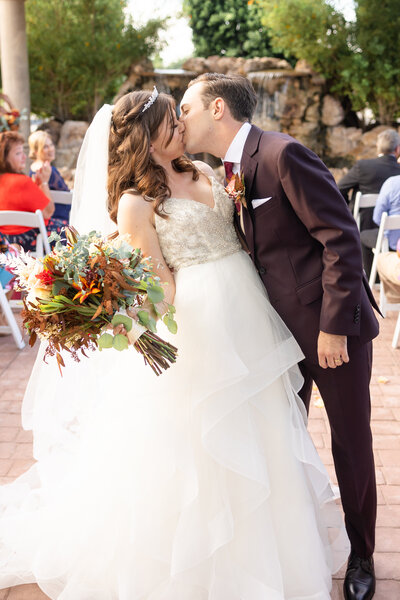 First kiss as husband and wife at Colby Falls in Gilbert, Az