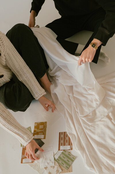 wedding planner looking at linen textiles
