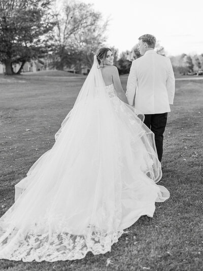 Bride and groom walking at PineCrest Country Club